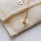 14k Light Yellow Gold Twin Flame Medal and Dangling Heart Moonstone Necklace / CELINE DAOUST