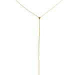 Gold lariat necklace on a white background