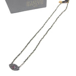 Necklace with eye-shaped pendant on a white background, branded 'Bohemian rhapsodie'.