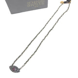 Necklace with eye-shaped pendant on a white background, branded 'Bohemian rhapsodie'.