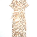 Beige and white zebra pattern dress on a hanger against a white background
