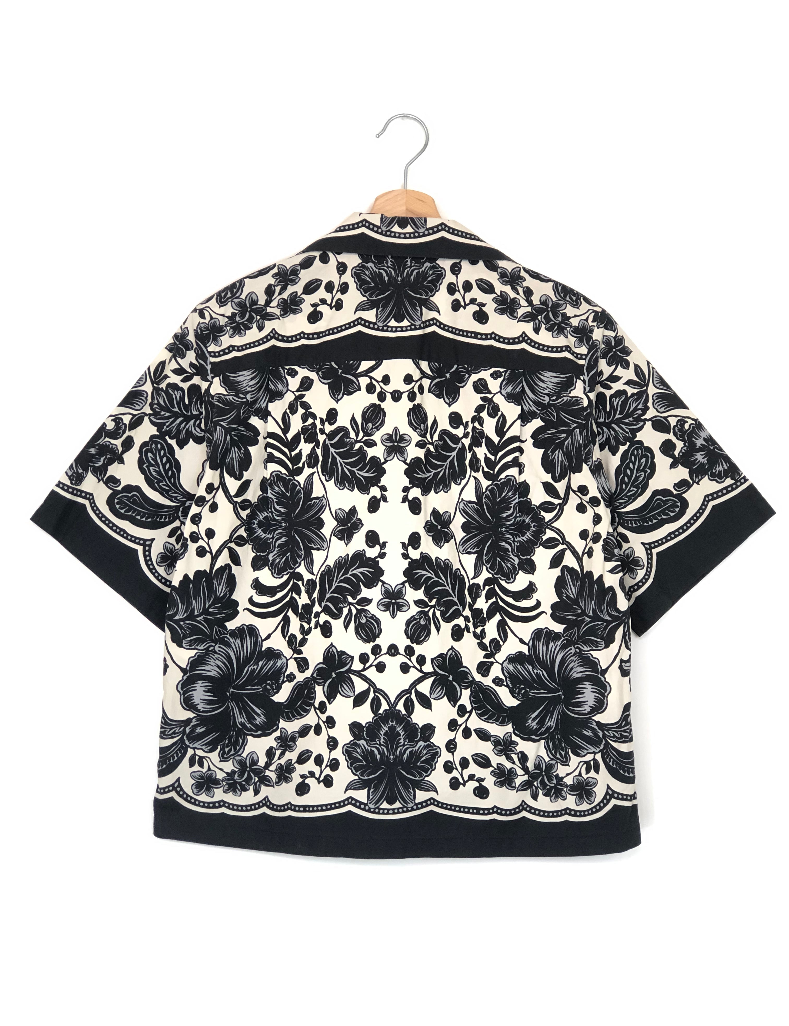 Black and white floral patterned fabric on a white background