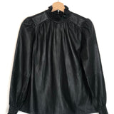 Black leather blouse with lace collar on a hanger against a white background