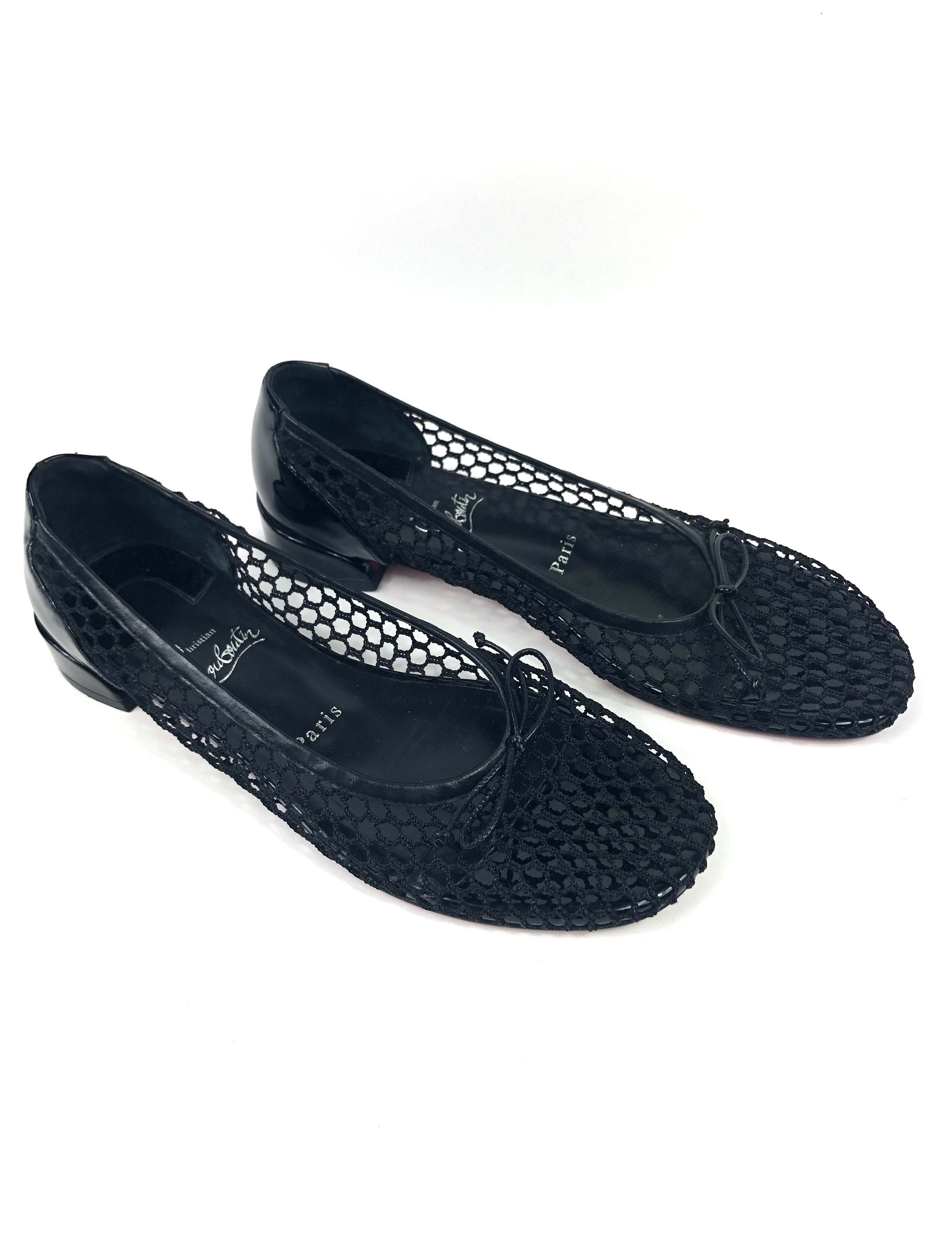 Black woven shoes on a white background