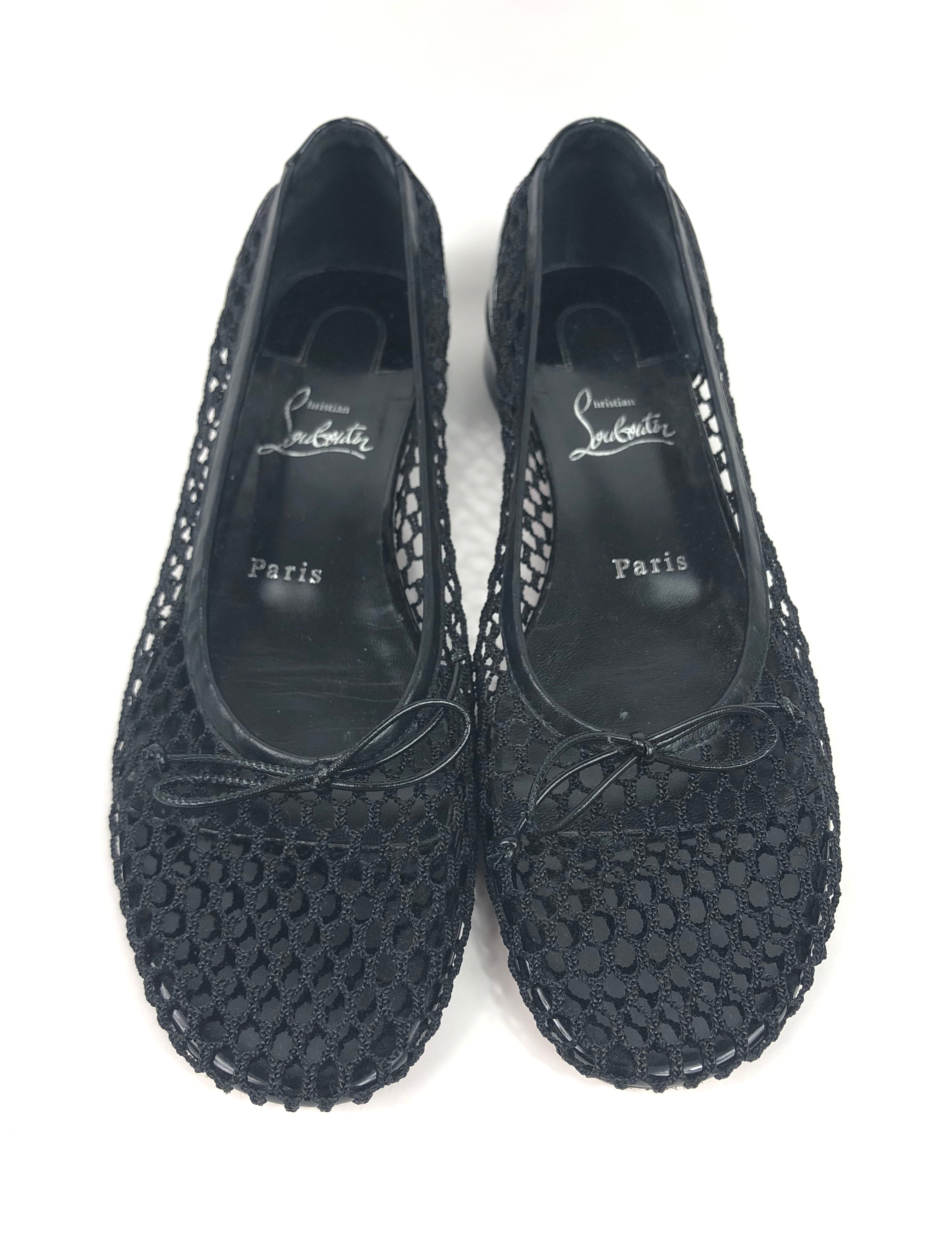 Pair of black textured shoes on a white background