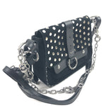 Black studded handbag with chain strap on a white background