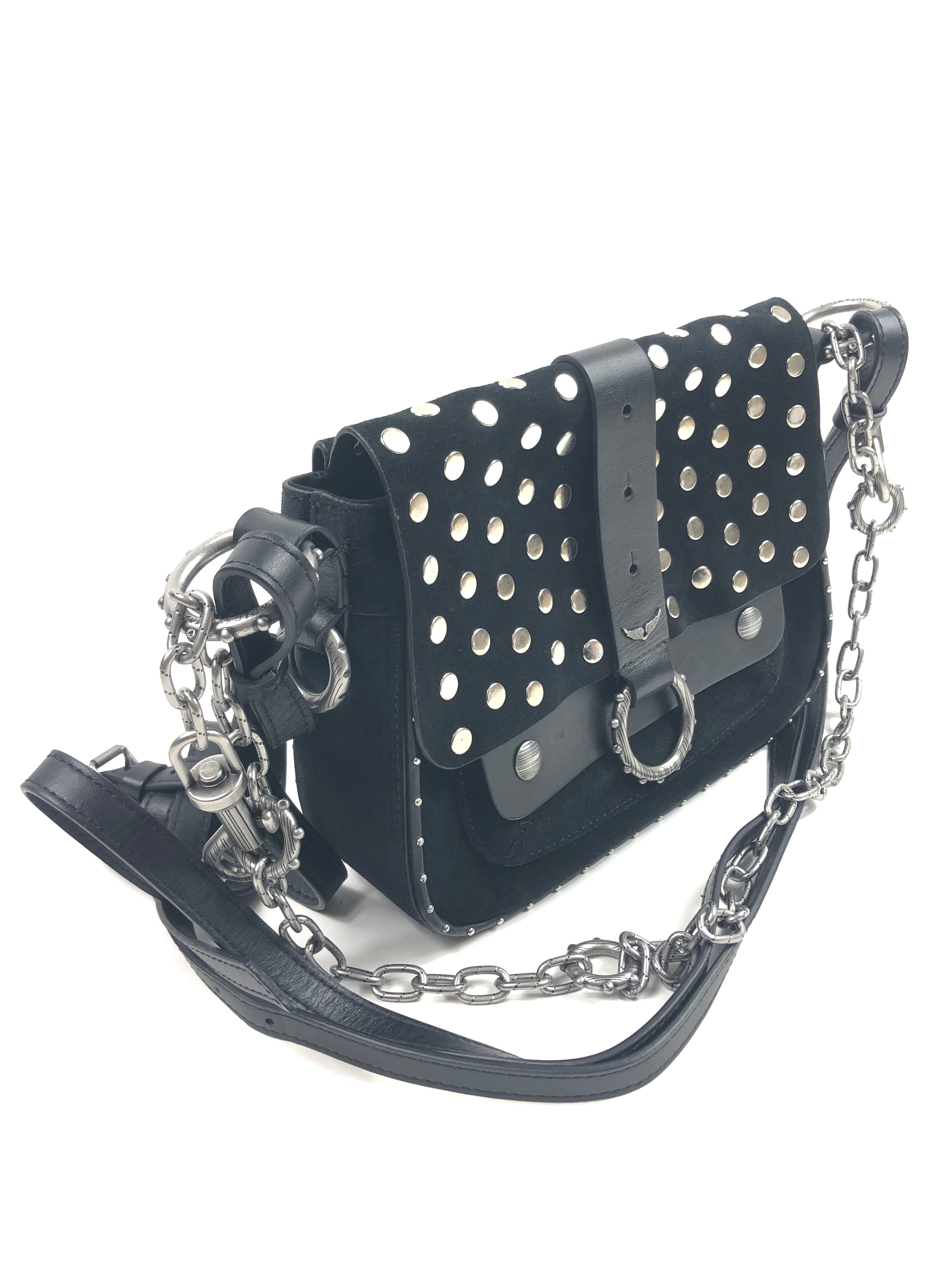 Black studded handbag with chain strap on a white background