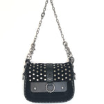 Black studded handbag with a chain strap on a white background