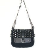 Black studded handbag with a chain strap on a white background