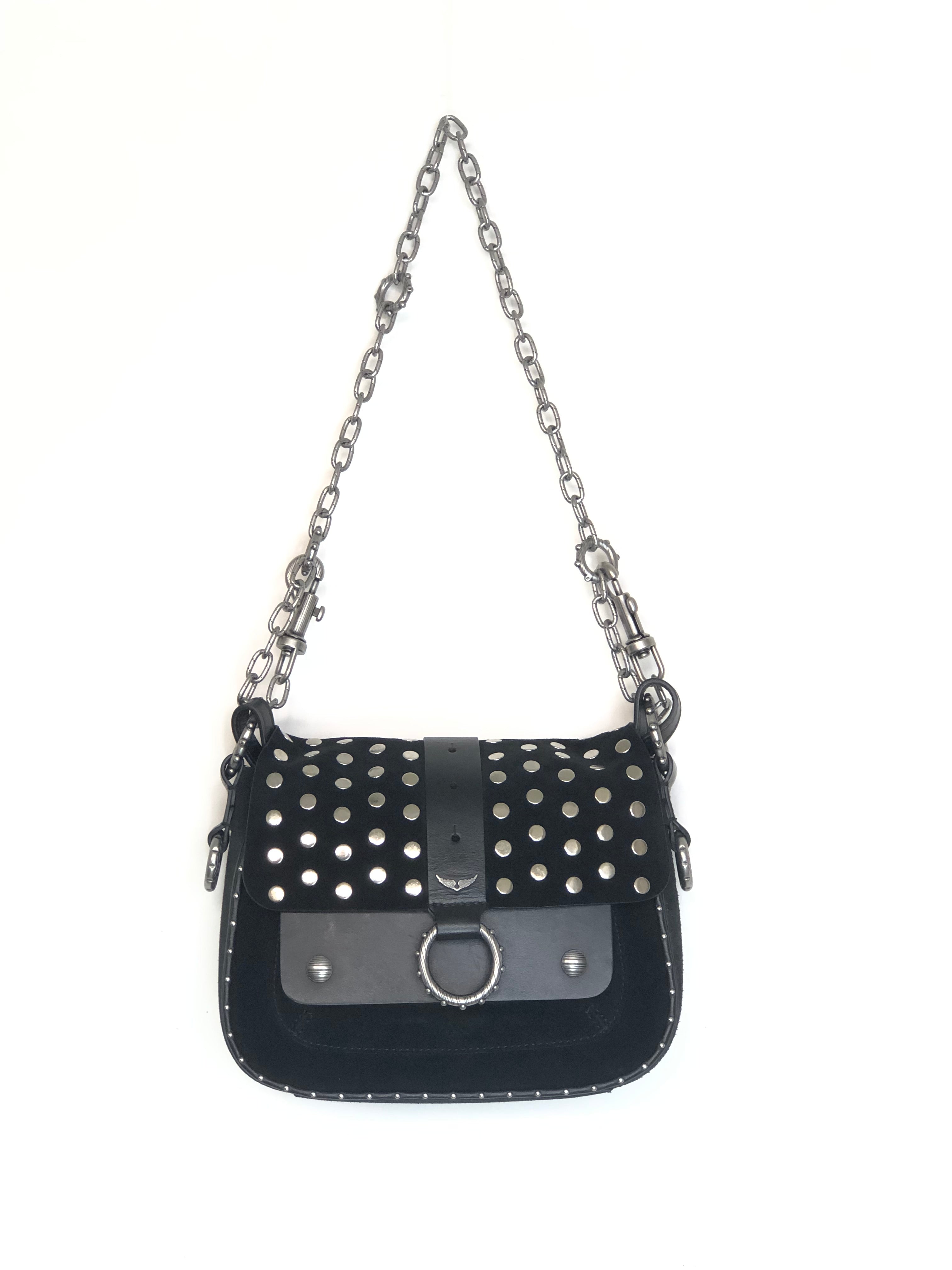 Black studded handbag with a chain strap on a white background