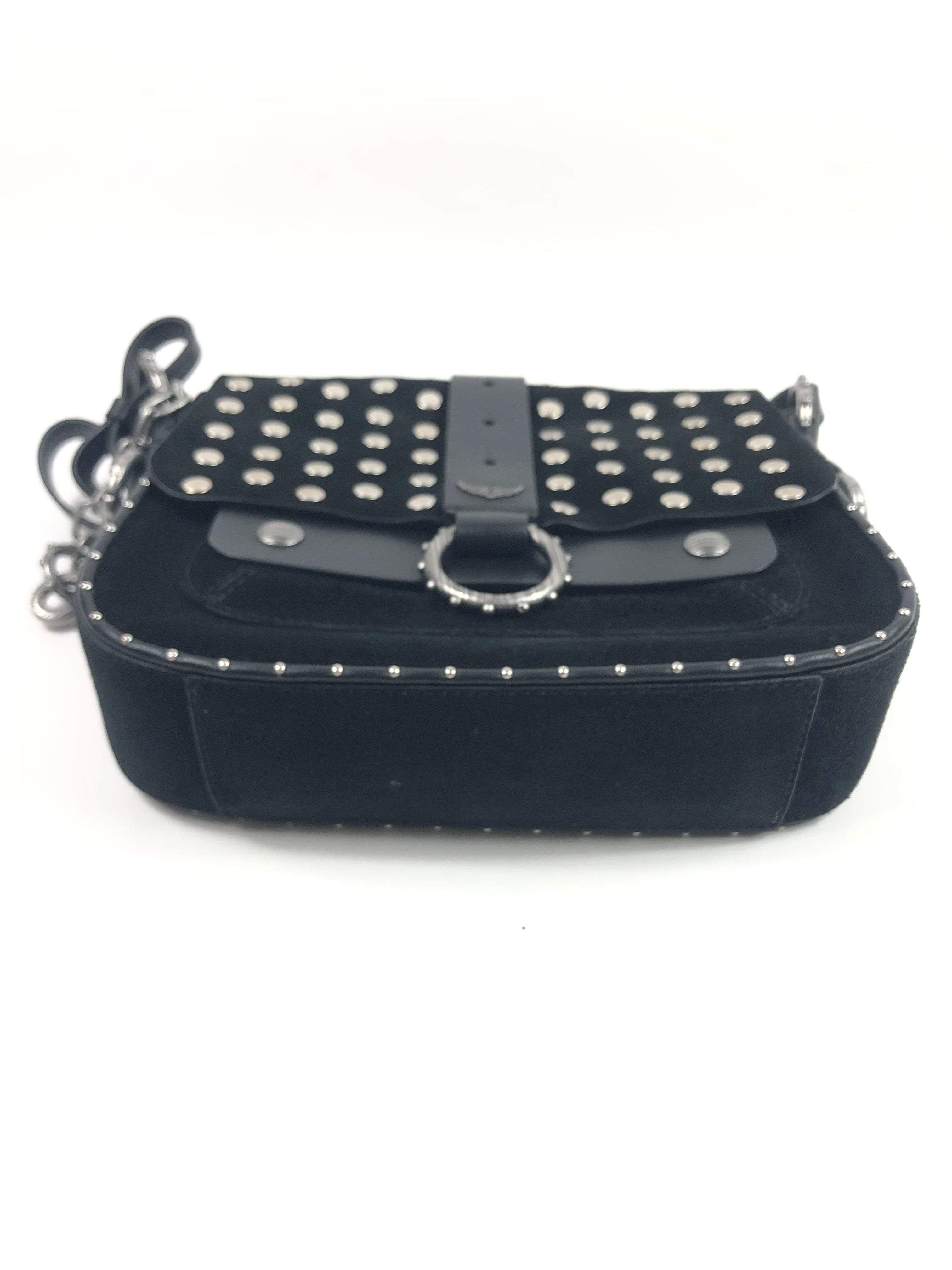 Black studded handbag with chain strap on a white background