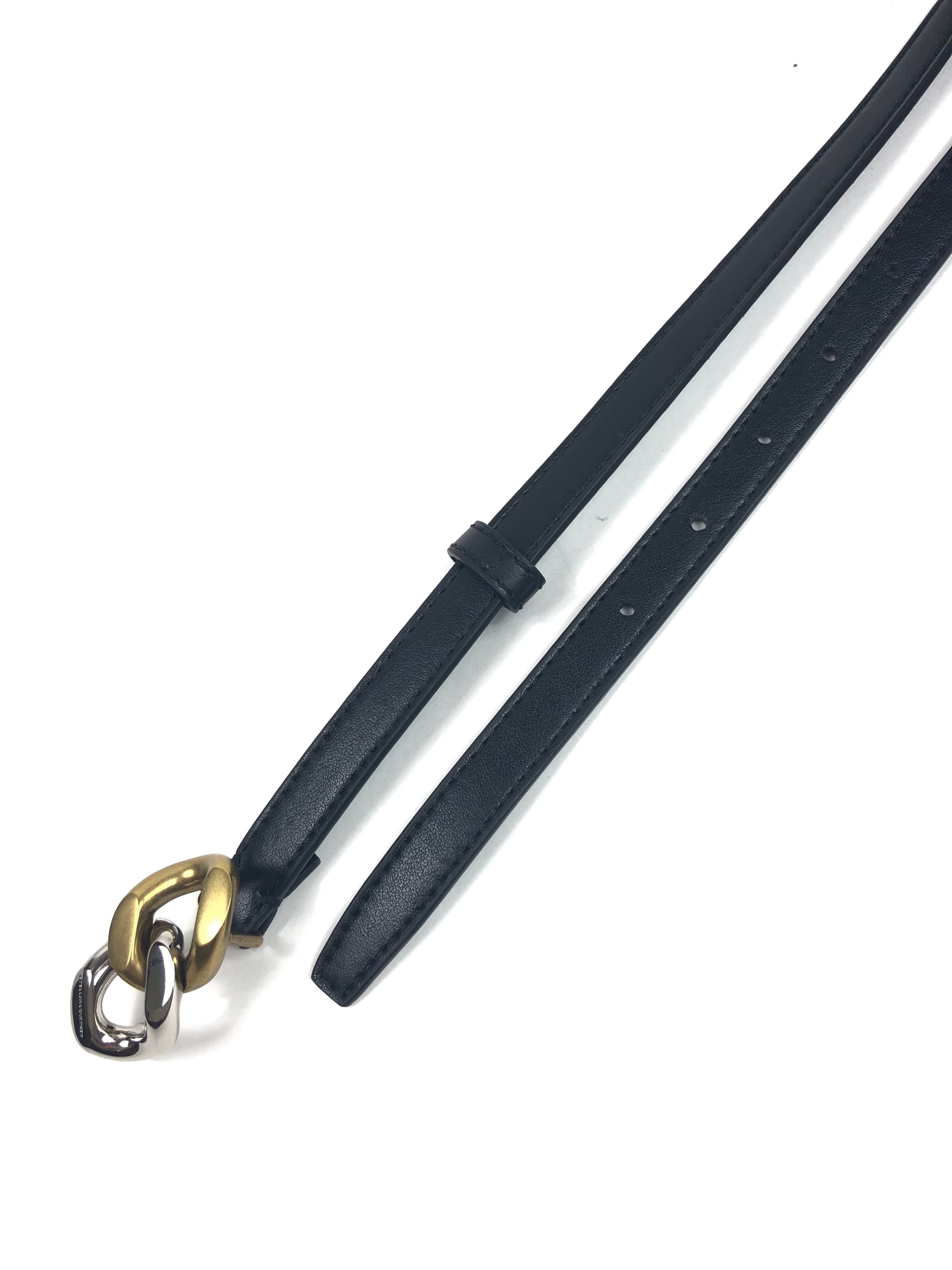 Black leather belt with a gold and silver clasp on a white background