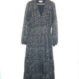 Long-sleeve dress with floral pattern on a hanger against a white background