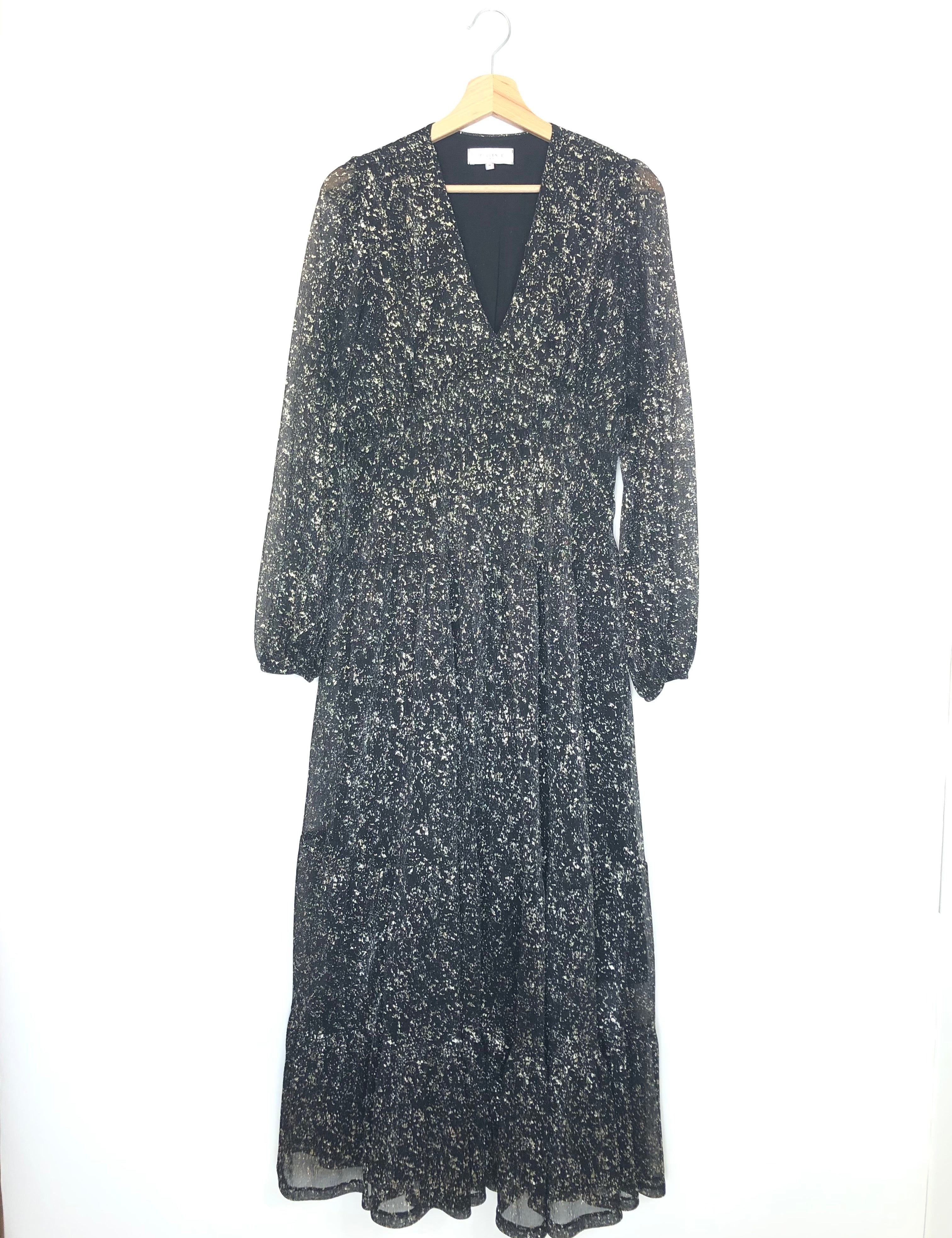 Long-sleeve dress with floral pattern on a hanger against a white background