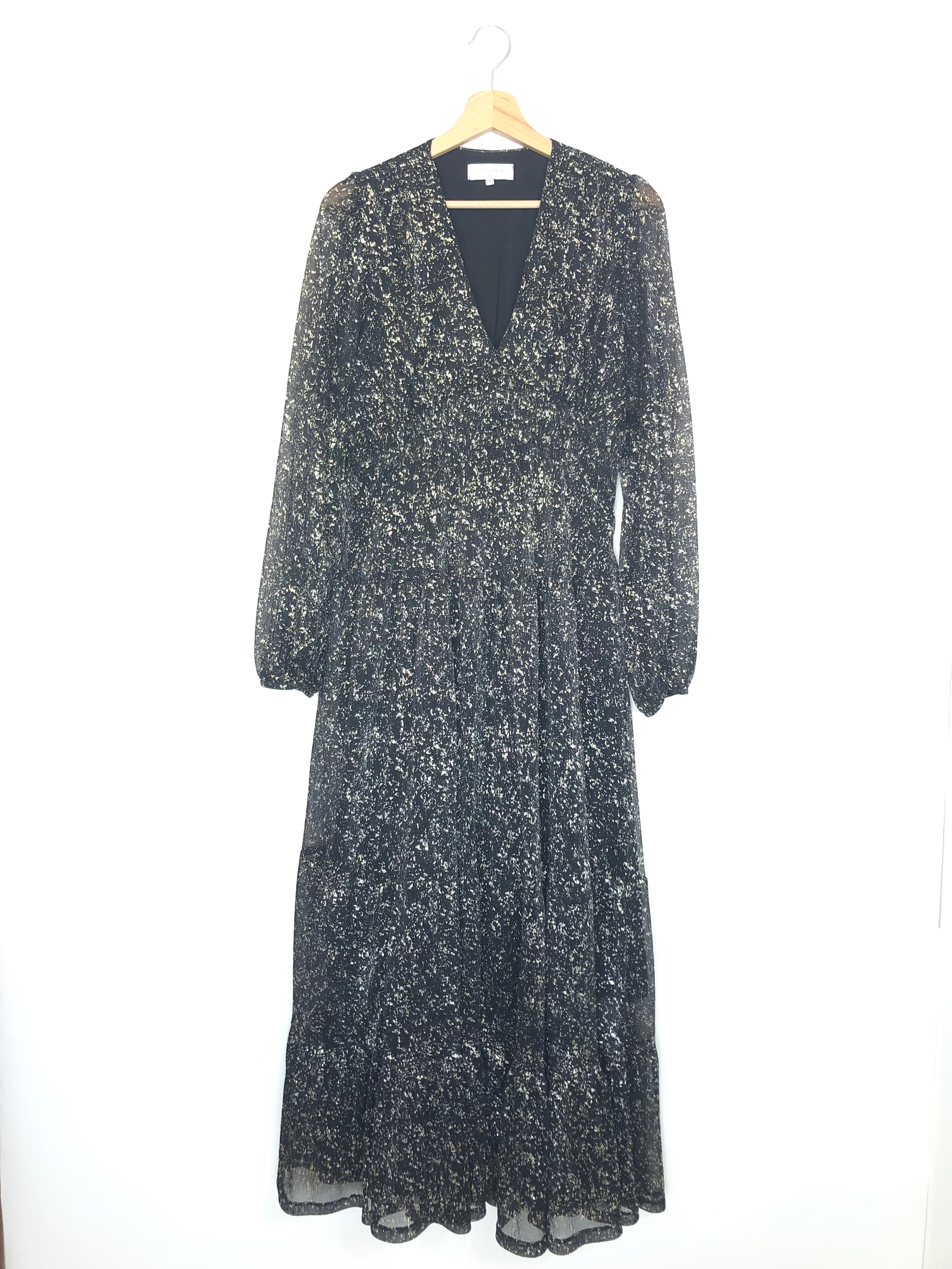 Long-sleeve dress with floral pattern on a hanger against a white background