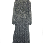 Long-sleeve dress with floral pattern on a hanger against a white background