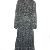 Long-sleeve dress with floral pattern on a hanger against a white background