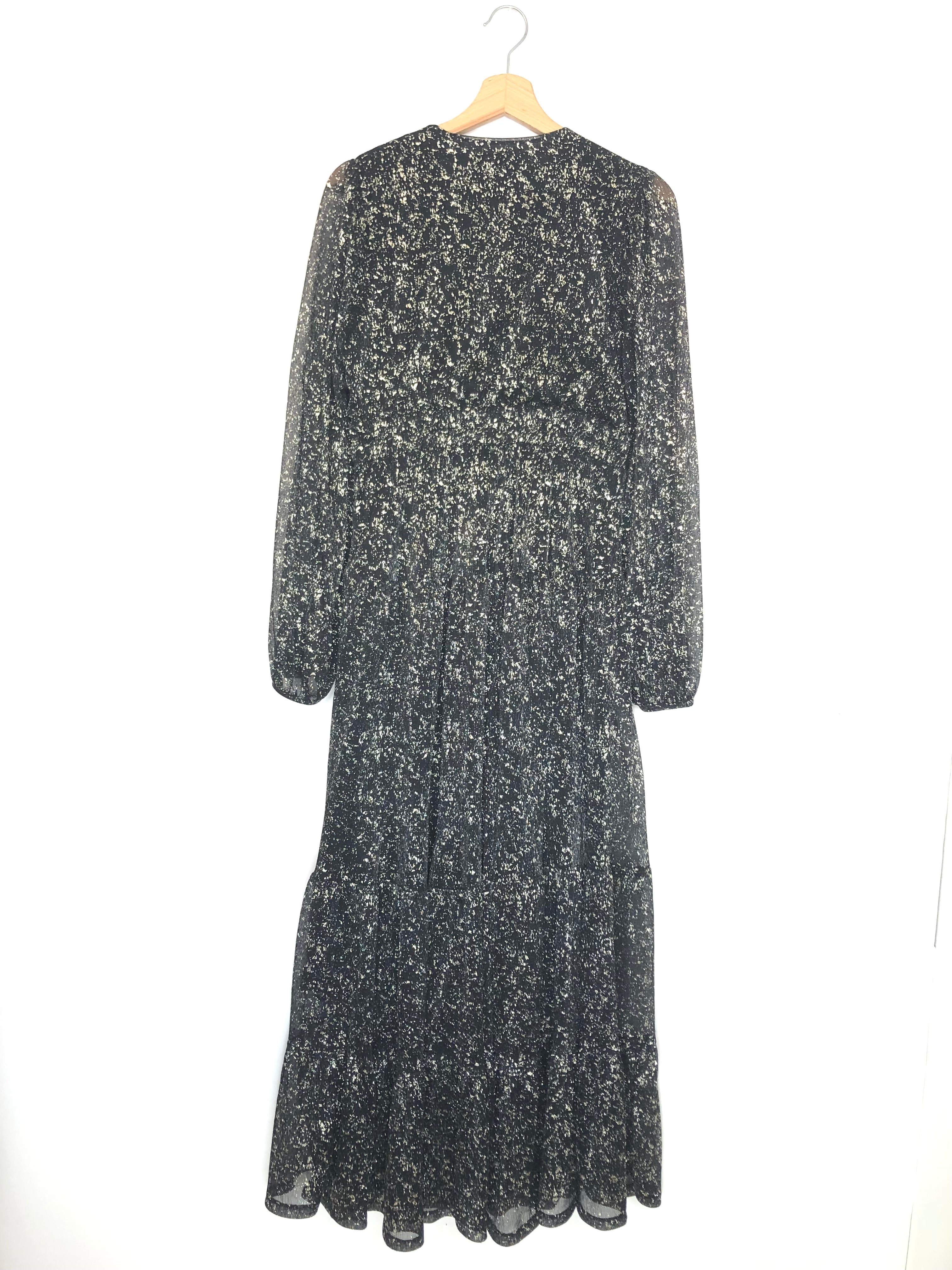 Long-sleeve dress with floral pattern on a hanger against a white background