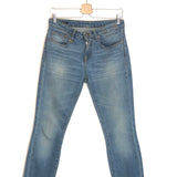 Blue jeans on a hanger against a white background