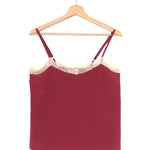 Maroon dress with lace trim on a wooden hanger against a white background