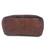 Brown leather handbag on a white background