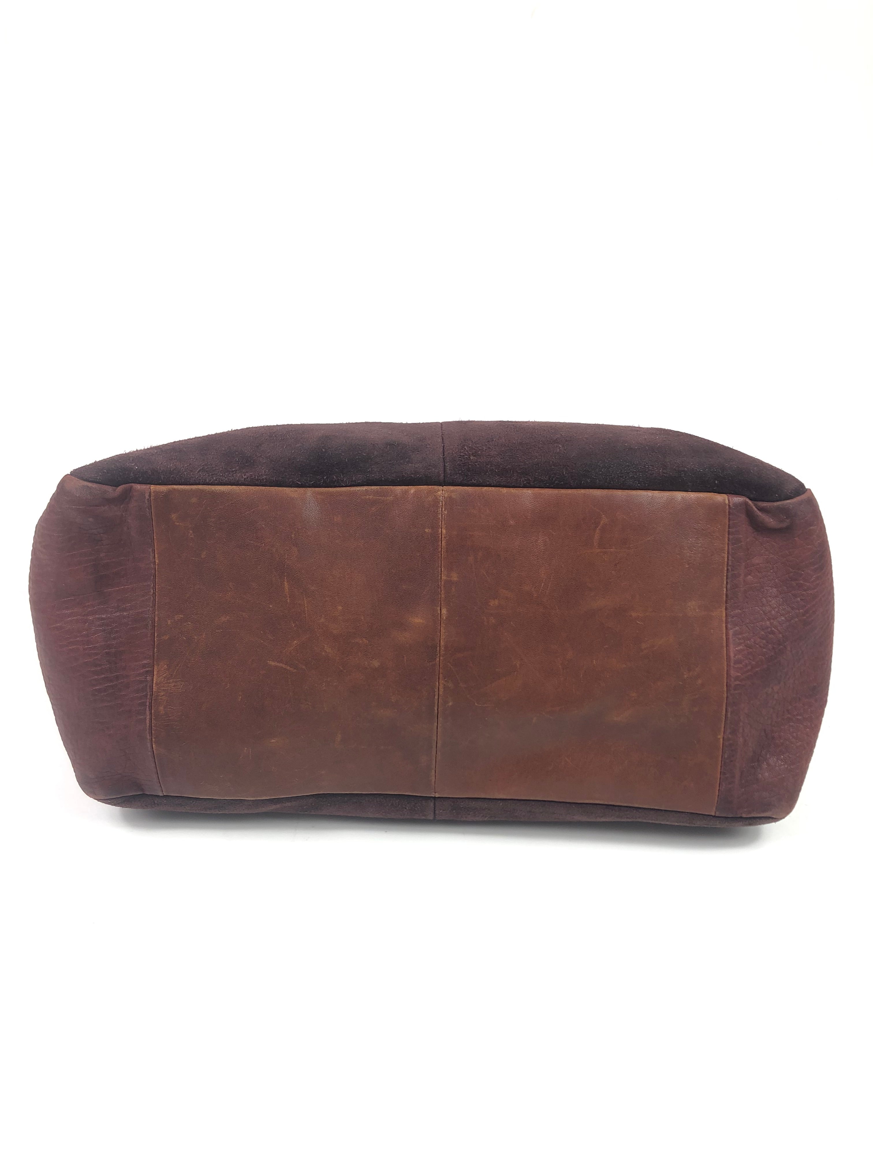 Brown leather handbag on a white background