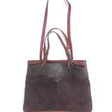 Brown leather handbag with gold clasp on a white background