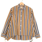 Striped shirt on a hanger against a white background