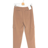 Beige pants hanging on a white background