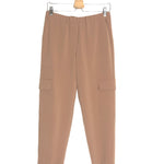 Beige pants on a hanger against a white background