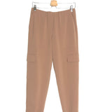 Beige pants on a hanger against a white background