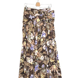 Floral patterned skirt on a hanger against a white background