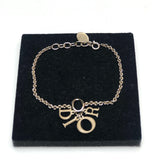 Gold Tone Crystal Multi DIOR Charm Bracelet / DIOR