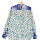 Floral shirt with checkered collar and sleeves on a hanger against a white background