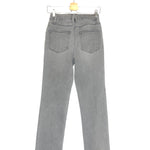 Gray jeans on a hanger against a white background