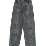 Gray jeans with decorative elements on a white background