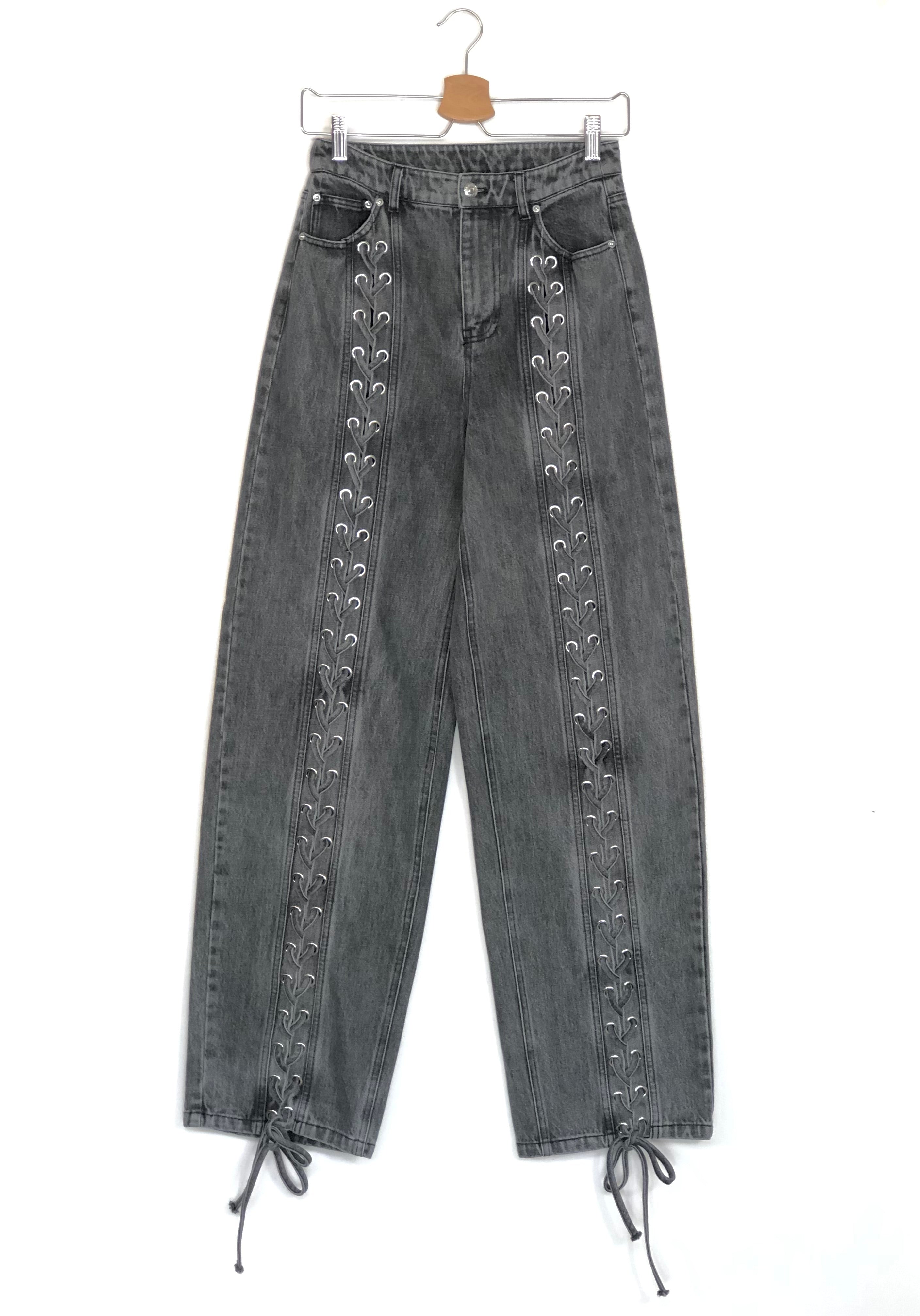 Gray jeans with decorative elements on a white background