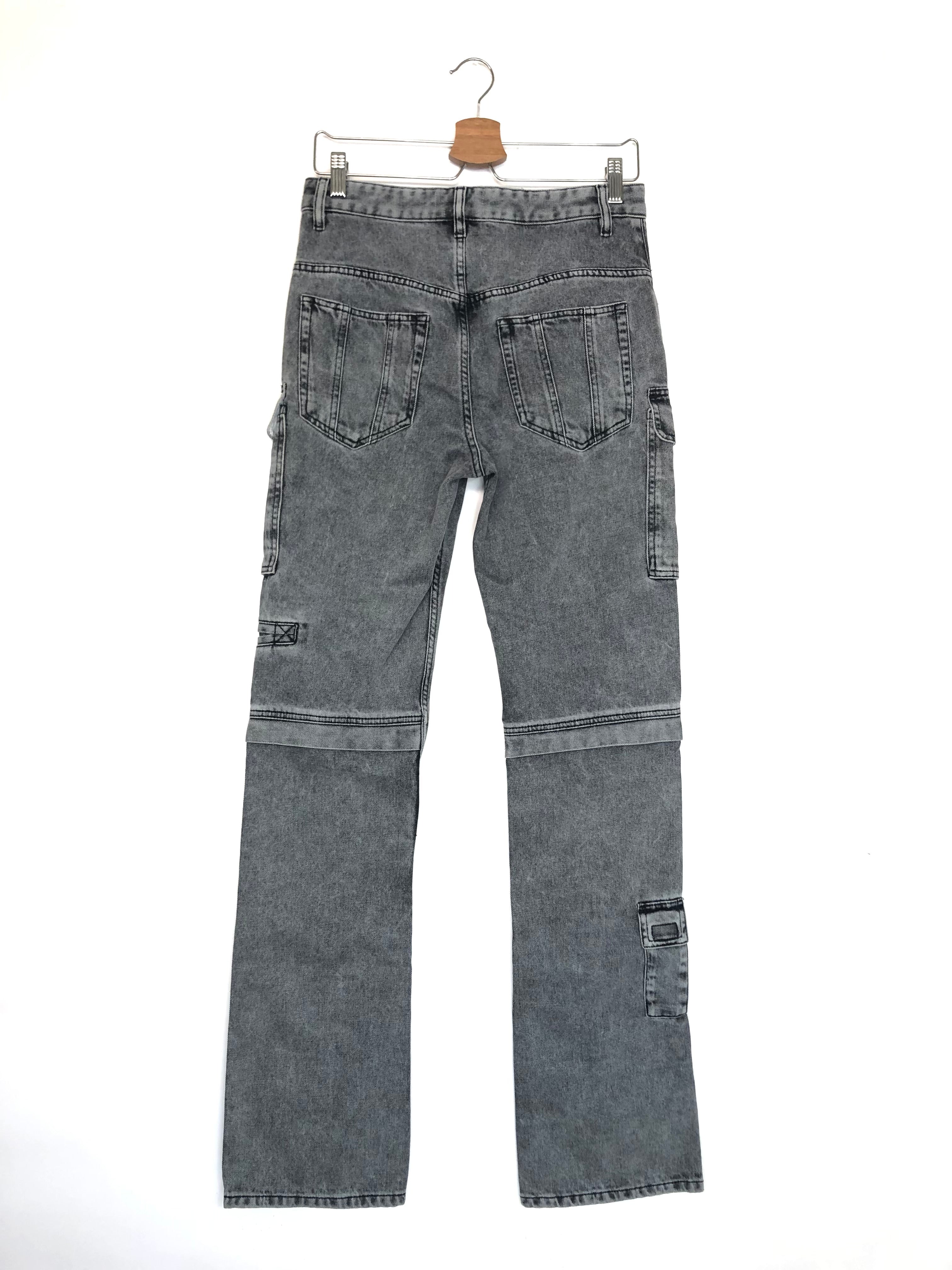 Gray denim jeans on a hanger against a white background