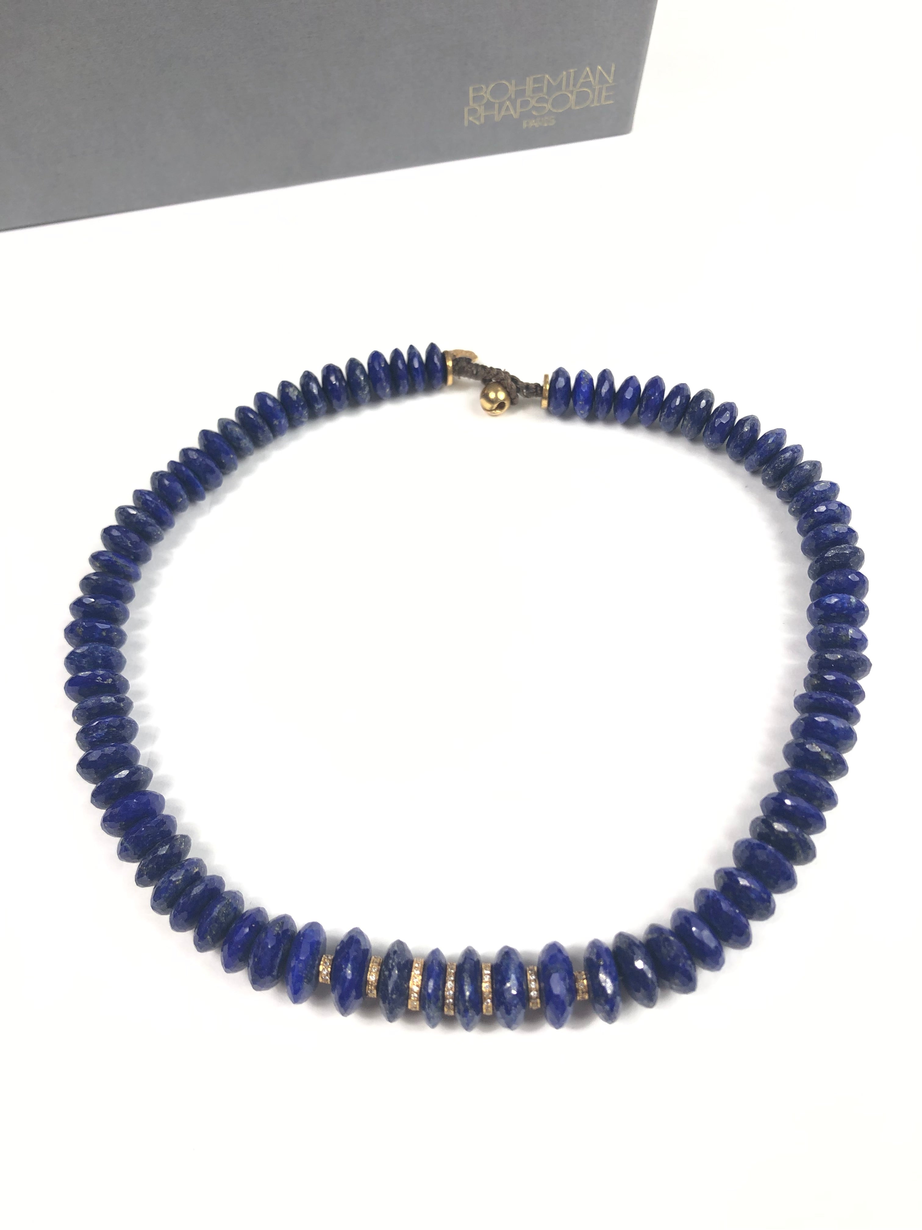 Blue beaded necklace on a white background