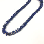 Blue beaded necklace on a white background