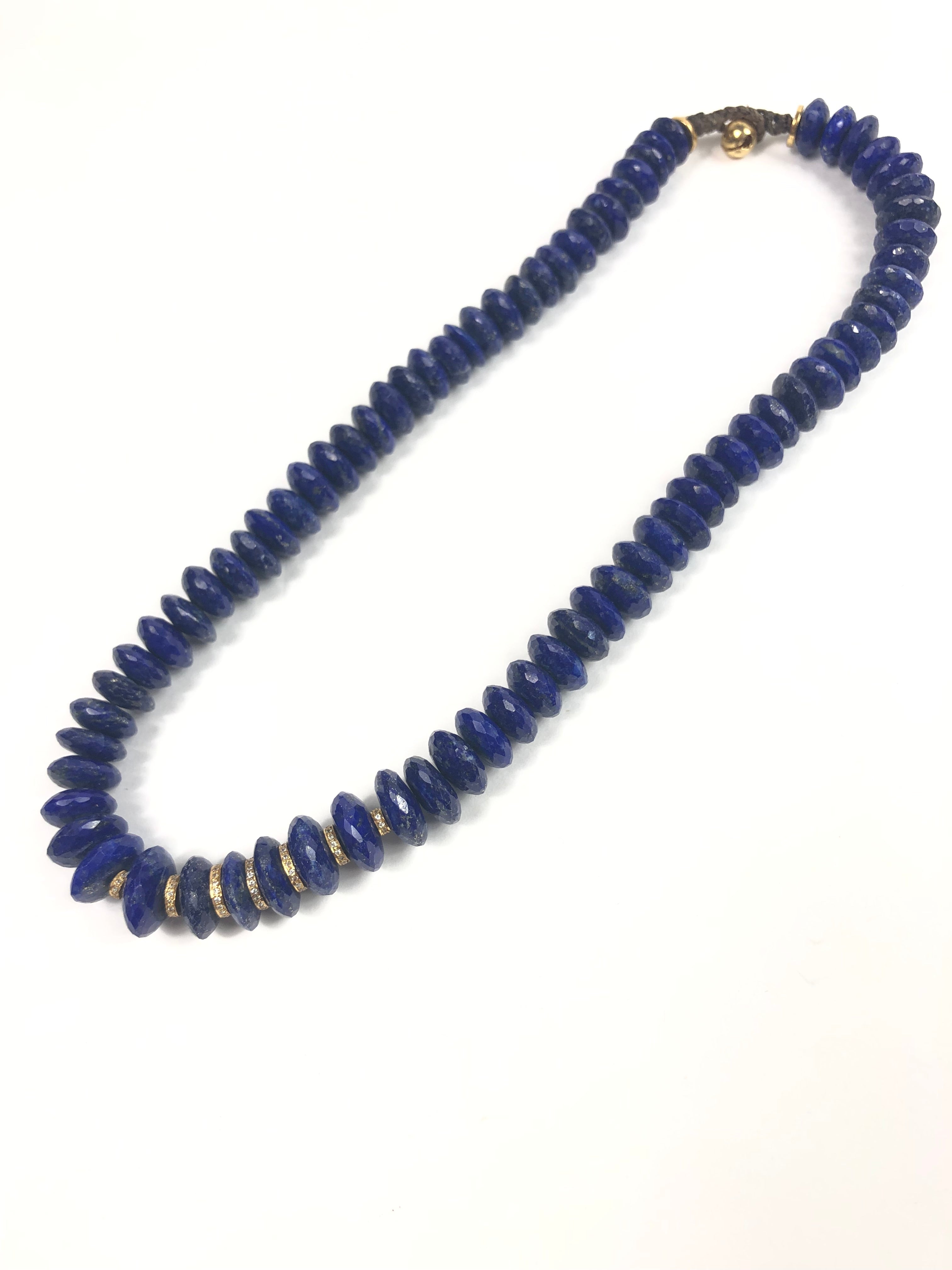 Blue beaded necklace on a white background