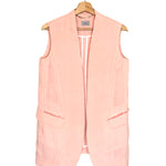 Pink vest on a hanger against a white background