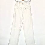 White jeans on a hanger against a white background