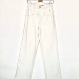 White jeans on a hanger against a white background