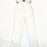 White pants on a hanger against a white background