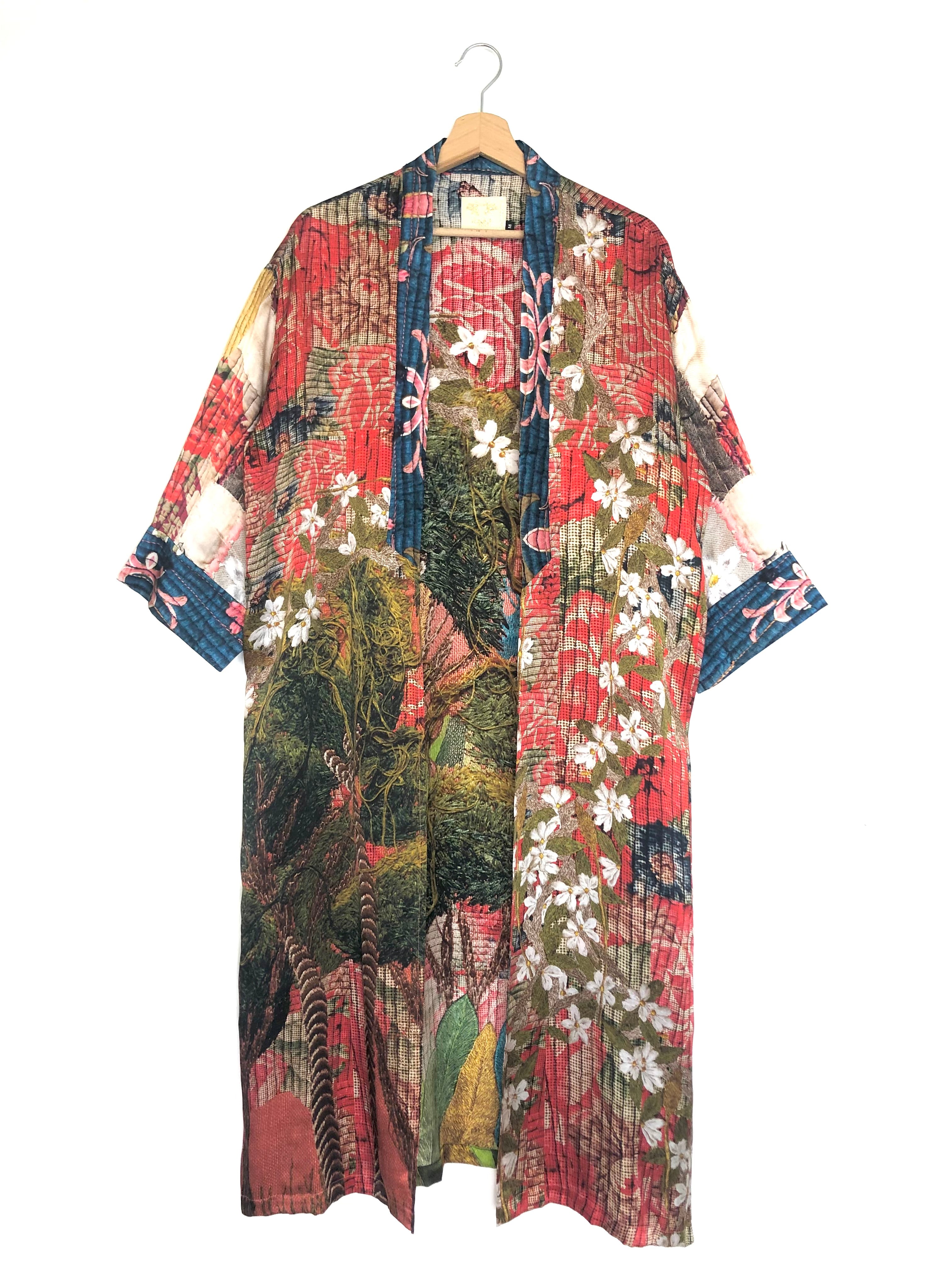 Colorful kimono-style garment with floral and abstract patterns on a white background