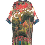 Colorful patterned kimono on a hanger against a white background