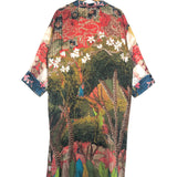 Colorful patterned kimono on a hanger against a white background