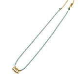 Woven Metallic Cord with Small Cylinder Barrel Pendant Necklace