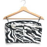 Zebra print strapless top on a wooden hanger against a white background